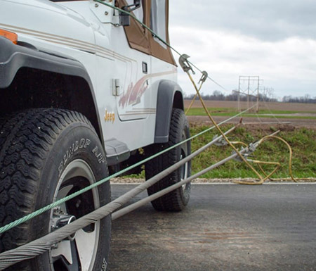 A Jeep in contact with electrical power lines