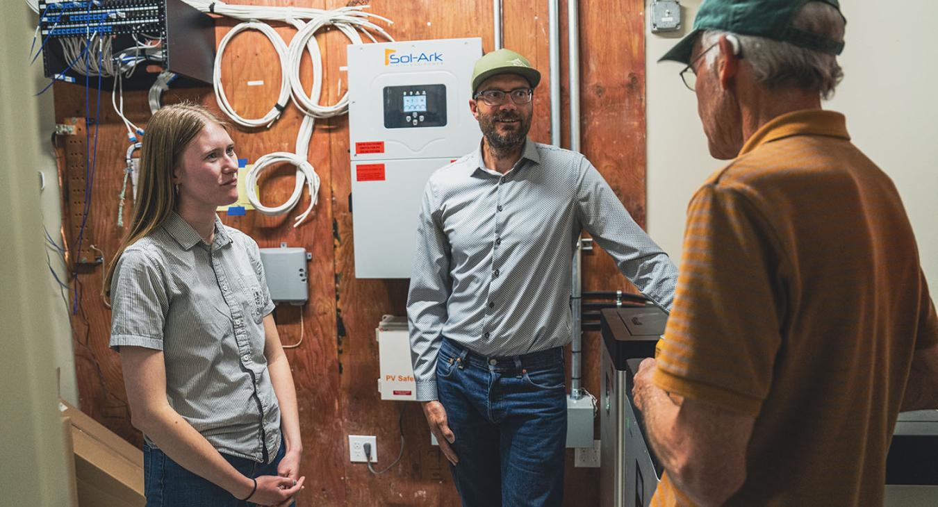 EcoAction Partners' Climate Action Coordinator, Kendra Held and San Miguel Power's Member and Energy Services Manager, Wiley Freeman discuss microgrids with REBEL (Renewable Energy and Beneficial Electrification League) member, Rein Van West.