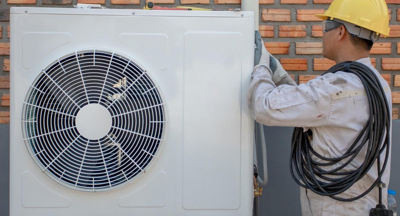 Technician Preparing to Install Heat Pump